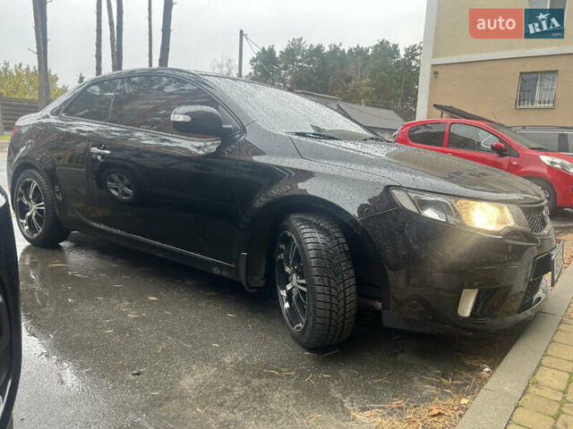 Чорний Кіа Черато, об'ємом двигуна 2 л та пробігом 209 тис. км за 8000 $, фото 11 на Automoto.ua