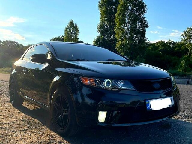 Чорний Кіа Черато, об'ємом двигуна 2 л та пробігом 238 тис. км за 7400 $, фото 4 на Automoto.ua