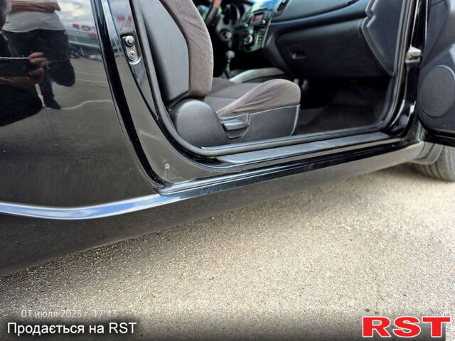 Черный Киа Черато, объемом двигателя 1.6 л и пробегом 154 тыс. км за 7400 $, фото 12 на Automoto.ua