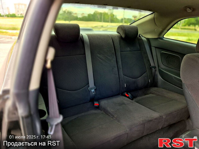 Черный Киа Черато, объемом двигателя 1.6 л и пробегом 154 тыс. км за 7400 $, фото 11 на Automoto.ua