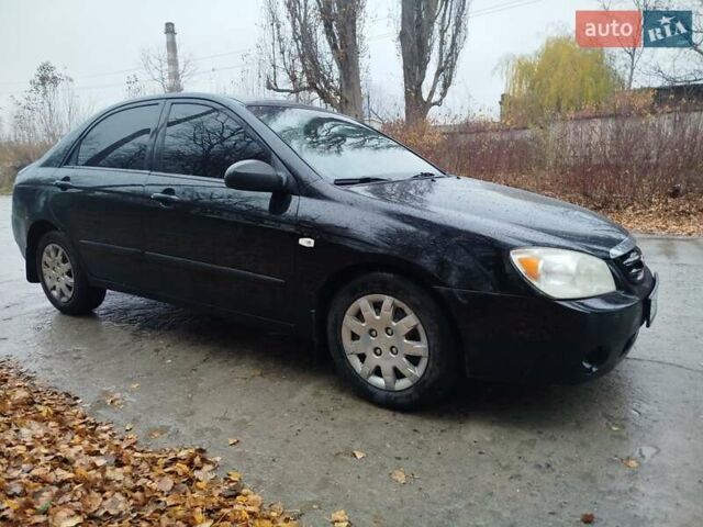 Черный Киа Черато, объемом двигателя 1.6 л и пробегом 280 тыс. км за 2999 $, фото 4 на Automoto.ua