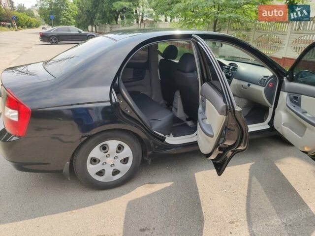 Черный Киа Черато, объемом двигателя 1.6 л и пробегом 168 тыс. км за 7000 $, фото 3 на Automoto.ua