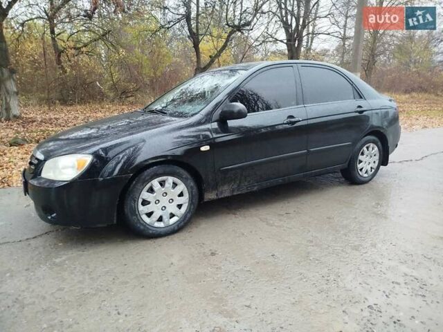 Черный Киа Черато, объемом двигателя 1.6 л и пробегом 280 тыс. км за 2999 $, фото 1 на Automoto.ua