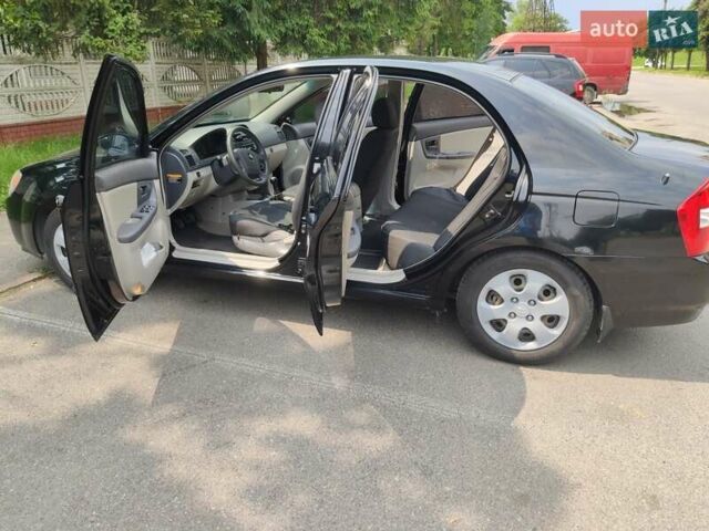 Черный Киа Черато, объемом двигателя 1.6 л и пробегом 168 тыс. км за 7000 $, фото 4 на Automoto.ua