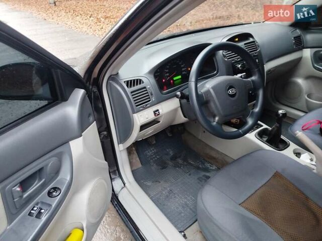 Черный Киа Черато, объемом двигателя 1.6 л и пробегом 280 тыс. км за 2999 $, фото 8 на Automoto.ua