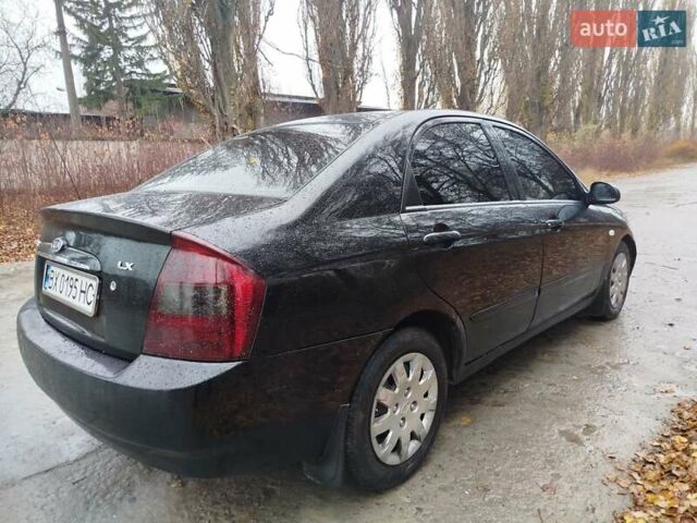 Черный Киа Черато, объемом двигателя 1.6 л и пробегом 280 тыс. км за 2999 $, фото 5 на Automoto.ua