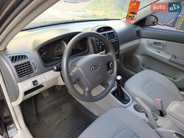 Чорний Кіа Черато, об'ємом двигуна 1.6 л та пробігом 237 тис. км за 5300 $, фото 23 на Automoto.ua