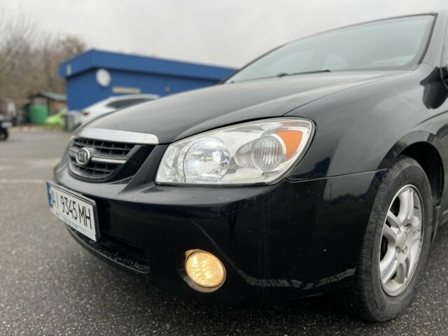 Черный Киа Черато, объемом двигателя 1.6 л и пробегом 230 тыс. км за 3200 $, фото 8 на Automoto.ua