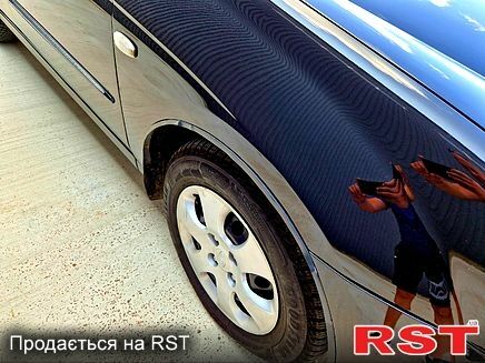 Черный Киа Черато, объемом двигателя 1.6 л и пробегом 300 тыс. км за 4000 $, фото 4 на Automoto.ua