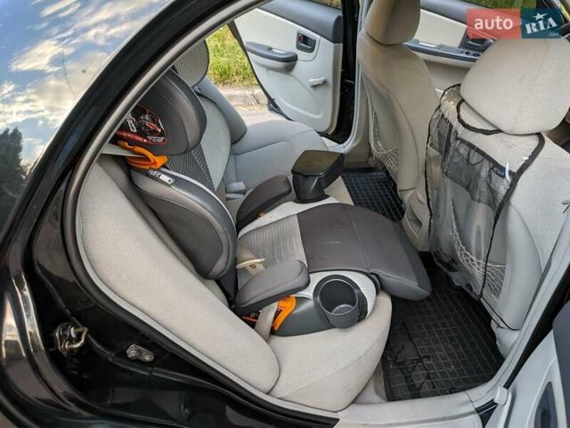 Чорний Кіа Черато, об'ємом двигуна 1.5 л та пробігом 221 тис. км за 4200 $, фото 13 на Automoto.ua