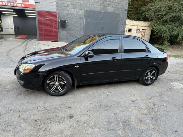 Черный Киа Черато, объемом двигателя 1.6 л и пробегом 286 тыс. км за 3500 $, фото 2 на Automoto.ua