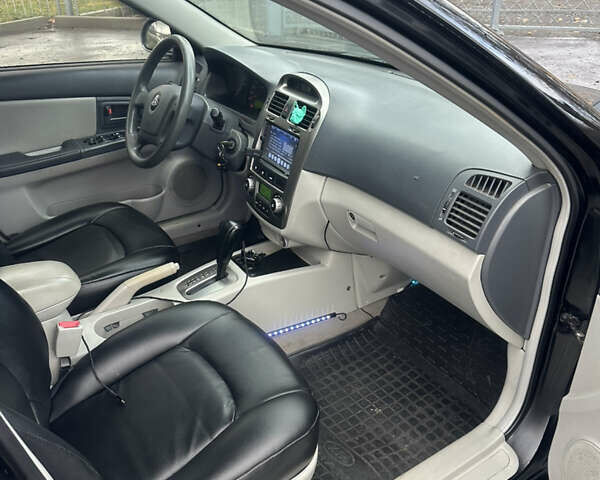 Черный Киа Черато, объемом двигателя 1.98 л и пробегом 236 тыс. км за 4100 $, фото 12 на Automoto.ua