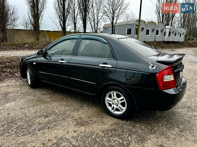 Чорний Кіа Черато, об'ємом двигуна 1.98 л та пробігом 240 тис. км за 5100 $, фото 5 на Automoto.ua