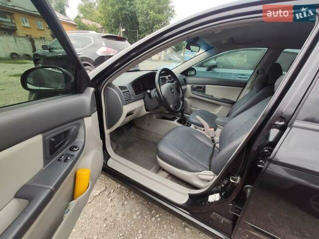 Черный Киа Черато, объемом двигателя 1.59 л и пробегом 203 тыс. км за 4400 $, фото 2 на Automoto.ua