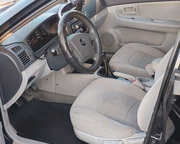 Черный Киа Черато, объемом двигателя 1.6 л и пробегом 230 тыс. км за 4250 $, фото 8 на Automoto.ua