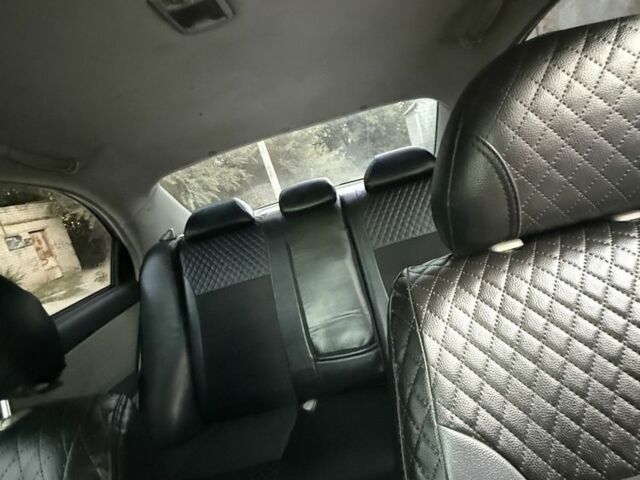 Черный Киа Черато, объемом двигателя 1.6 л и пробегом 286 тыс. км за 3500 $, фото 7 на Automoto.ua