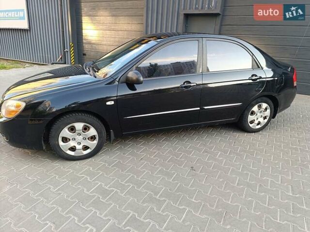 Чорний Кіа Черато, об'ємом двигуна 1.6 л та пробігом 237 тис. км за 5300 $, фото 11 на Automoto.ua