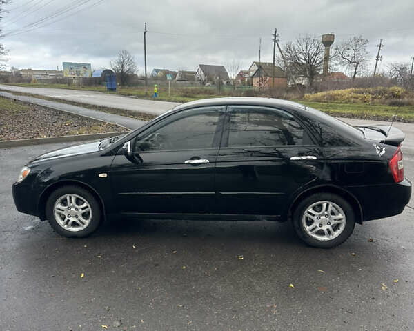 Черный Киа Черато, объемом двигателя 1.98 л и пробегом 236 тыс. км за 4100 $, фото 7 на Automoto.ua