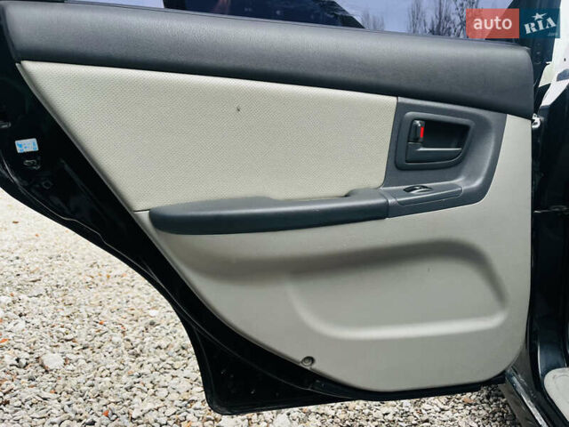 Чорний Кіа Черато, об'ємом двигуна 2 л та пробігом 319 тис. км за 4300 $, фото 15 на Automoto.ua