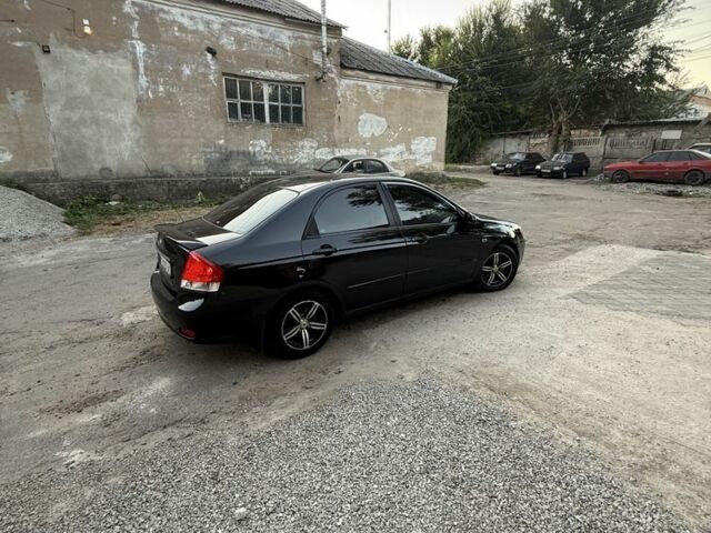 Черный Киа Черато, объемом двигателя 1.6 л и пробегом 286 тыс. км за 3500 $, фото 4 на Automoto.ua