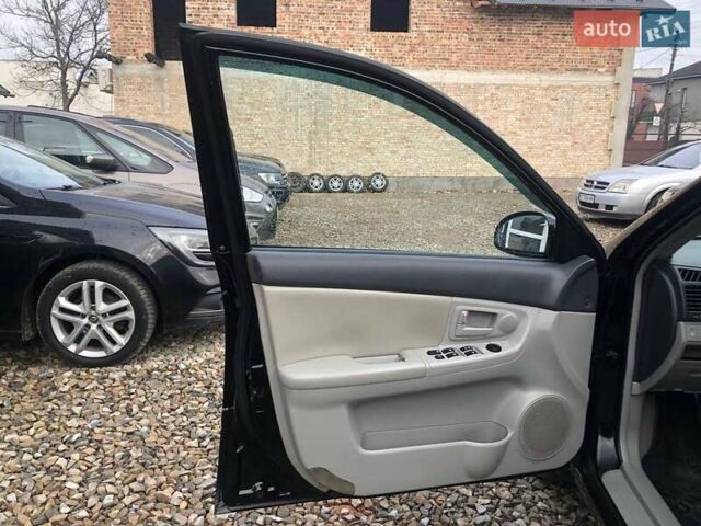 Чорний Кіа Черато, об'ємом двигуна 2 л та пробігом 177 тис. км за 4399 $, фото 11 на Automoto.ua