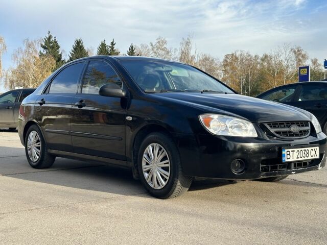 Черный Киа Черато, объемом двигателя 1.6 л и пробегом 245 тыс. км за 2850 $, фото 1 на Automoto.ua