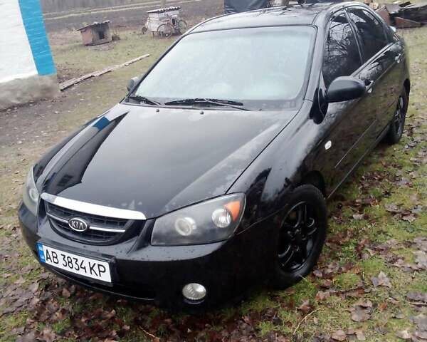 Черный Киа Черато, объемом двигателя 2 л и пробегом 240 тыс. км за 4200 $, фото 1 на Automoto.ua