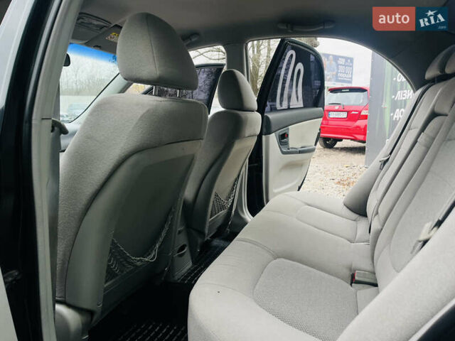 Чорний Кіа Черато, об'ємом двигуна 2 л та пробігом 319 тис. км за 4300 $, фото 12 на Automoto.ua