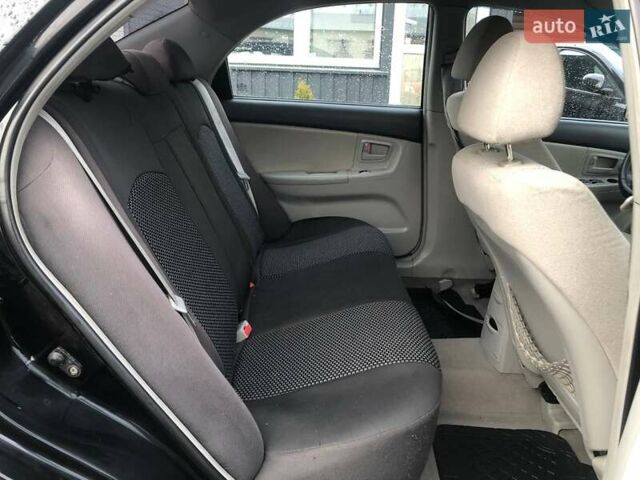 Чорний Кіа Черато, об'ємом двигуна 2 л та пробігом 177 тис. км за 4399 $, фото 21 на Automoto.ua