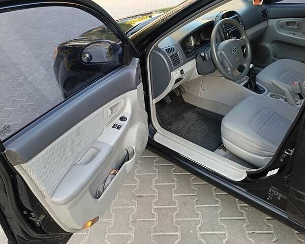 Чорний Кіа Черато, об'ємом двигуна 1.6 л та пробігом 237 тис. км за 5300 $, фото 25 на Automoto.ua