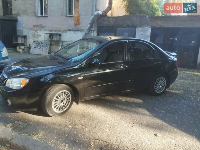 Черный Киа Черато, объемом двигателя 2 л и пробегом 220 тыс. км за 4900 $, фото 6 на Automoto.ua
