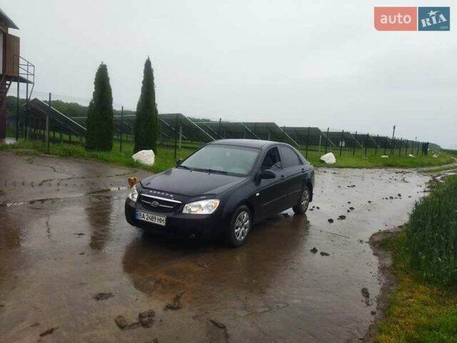 Черный Киа Черато, объемом двигателя 1.6 л и пробегом 300 тыс. км за 3900 $, фото 1 на Automoto.ua