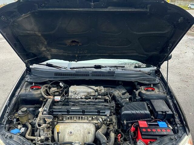 Черный Киа Черато, объемом двигателя 2 л и пробегом 232 тыс. км за 4100 $, фото 12 на Automoto.ua