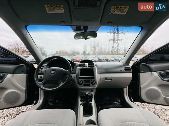 Чорний Кіа Черато, об'ємом двигуна 2 л та пробігом 319 тис. км за 4300 $, фото 13 на Automoto.ua