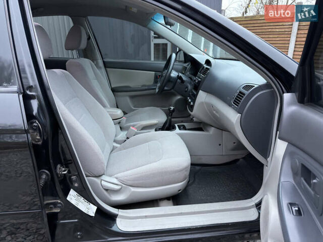 Черный Киа Черато, объемом двигателя 1.6 л и пробегом 220 тыс. км за 3300 $, фото 18 на Automoto.ua