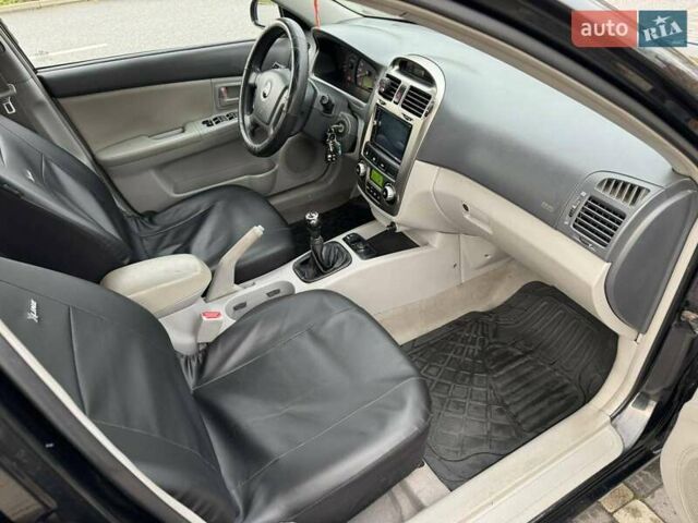 Чорний Кіа Черато, об'ємом двигуна 1.98 л та пробігом 177 тис. км за 3950 $, фото 2 на Automoto.ua