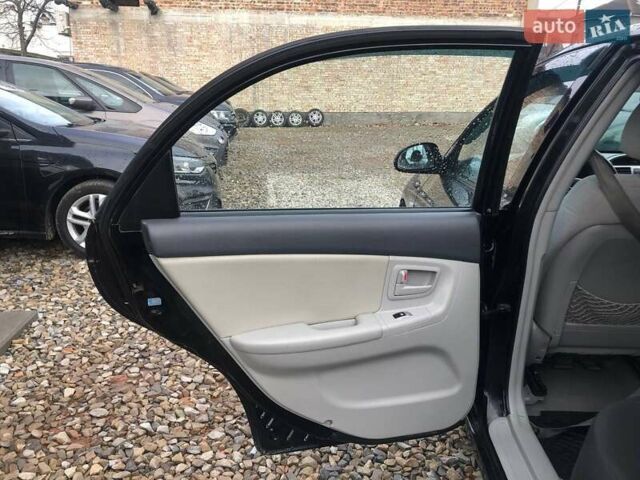 Чорний Кіа Черато, об'ємом двигуна 2 л та пробігом 177 тис. км за 4399 $, фото 14 на Automoto.ua