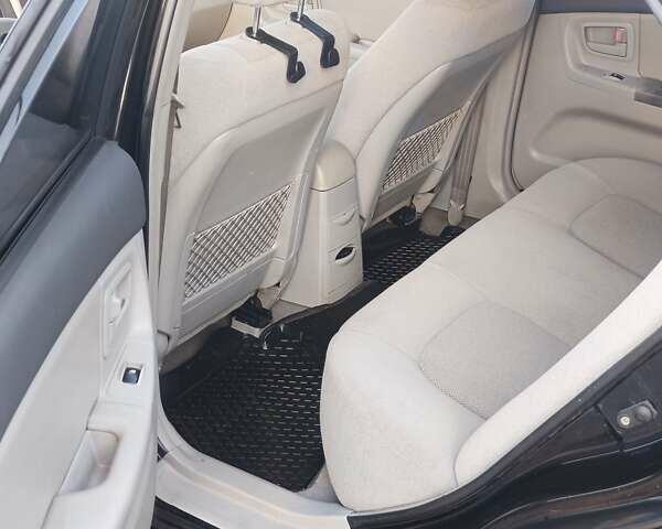 Черный Киа Черато, объемом двигателя 1.6 л и пробегом 230 тыс. км за 4250 $, фото 7 на Automoto.ua