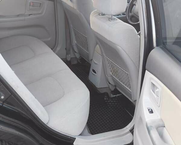 Черный Киа Черато, объемом двигателя 1.6 л и пробегом 230 тыс. км за 4250 $, фото 6 на Automoto.ua