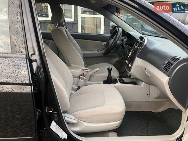 Чорний Кіа Черато, об'ємом двигуна 2 л та пробігом 177 тис. км за 4399 $, фото 22 на Automoto.ua