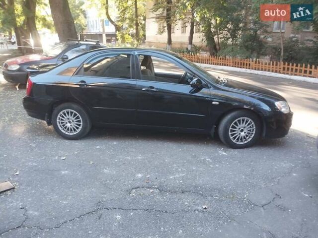 Черный Киа Черато, объемом двигателя 2 л и пробегом 220 тыс. км за 4900 $, фото 2 на Automoto.ua
