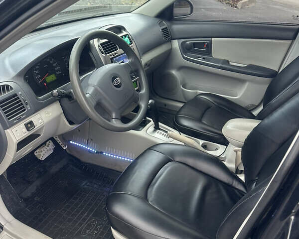 Черный Киа Черато, объемом двигателя 1.98 л и пробегом 236 тыс. км за 4100 $, фото 11 на Automoto.ua