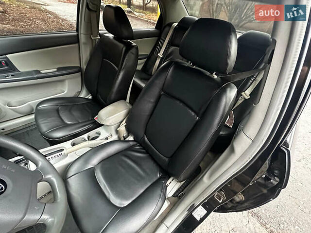 Чорний Кіа Черато, об'ємом двигуна 1.98 л та пробігом 240 тис. км за 5100 $, фото 7 на Automoto.ua