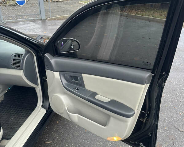 Черный Киа Черато, объемом двигателя 1.98 л и пробегом 236 тыс. км за 4100 $, фото 16 на Automoto.ua