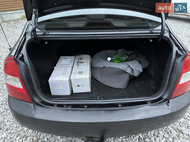 Черный Киа Черато, объемом двигателя 1.6 л и пробегом 220 тыс. км за 3300 $, фото 19 на Automoto.ua
