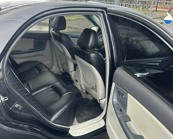 Черный Киа Черато, объемом двигателя 1.98 л и пробегом 236 тыс. км за 4100 $, фото 13 на Automoto.ua