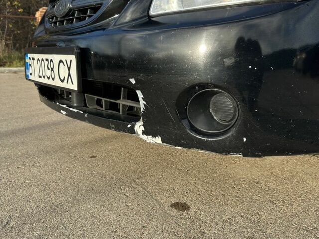 Черный Киа Черато, объемом двигателя 1.6 л и пробегом 245 тыс. км за 2850 $, фото 5 на Automoto.ua