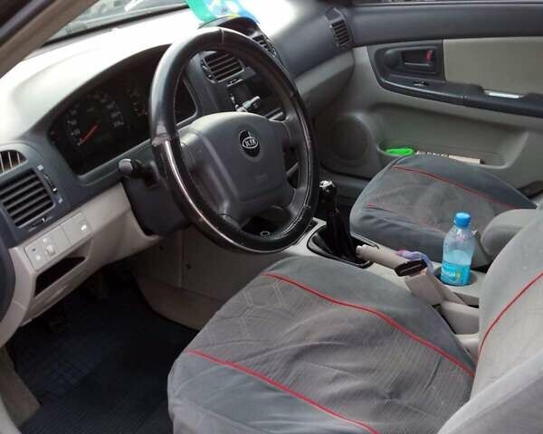 Черный Киа Черато, объемом двигателя 1.6 л и пробегом 220 тыс. км за 5400 $, фото 1 на Automoto.ua