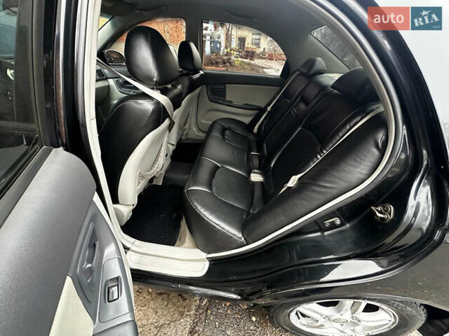 Чорний Кіа Черато, об'ємом двигуна 1.98 л та пробігом 240 тис. км за 5100 $, фото 8 на Automoto.ua
