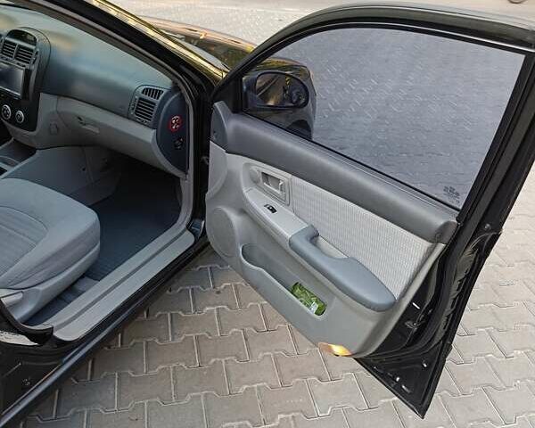 Чорний Кіа Черато, об'ємом двигуна 1.6 л та пробігом 237 тис. км за 5300 $, фото 16 на Automoto.ua